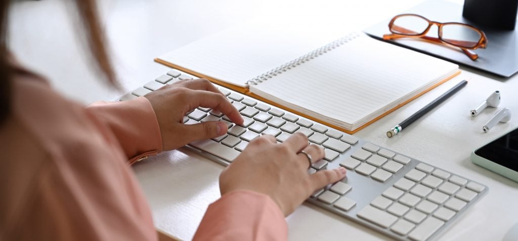 Hands Typing Laptop Notebook.